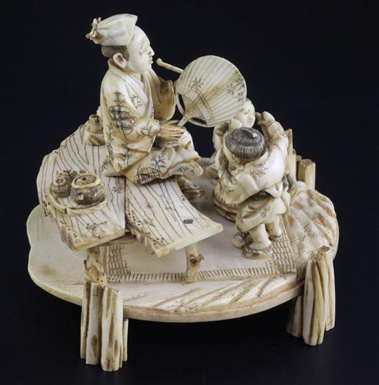 A Japanese ivory okimono of a man and two boys, signed Shomi, Meiji period 13cm, some faults